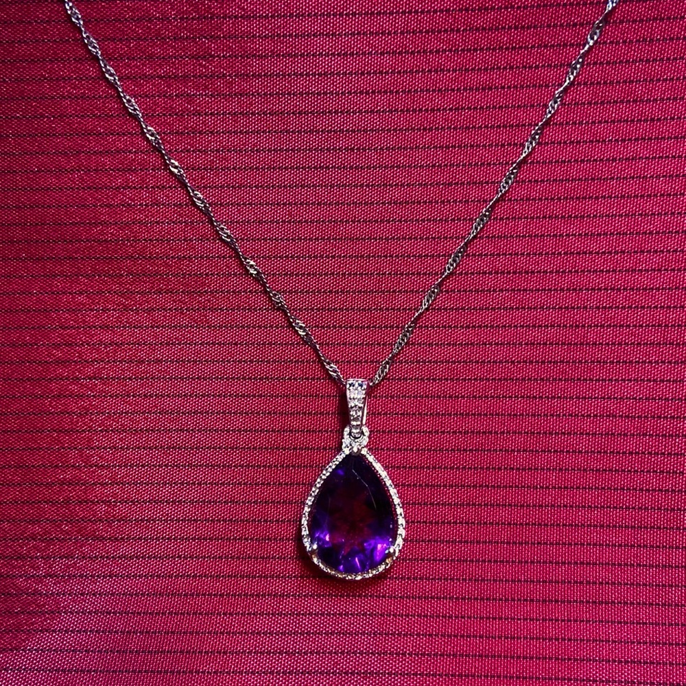 Made in Italy sterling silver and amethyst teardrop necklace.  Chain is 18”